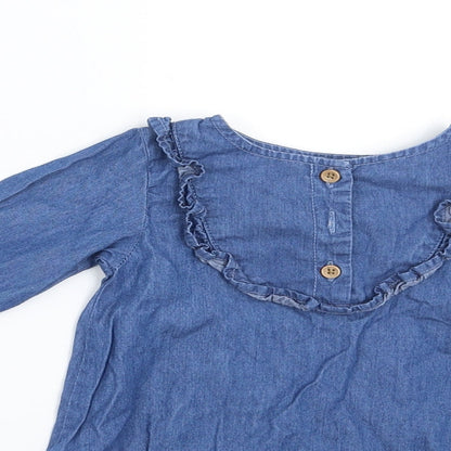 Close-up detail of Primark girls’ blue denim shirt dress, size 6-9, months