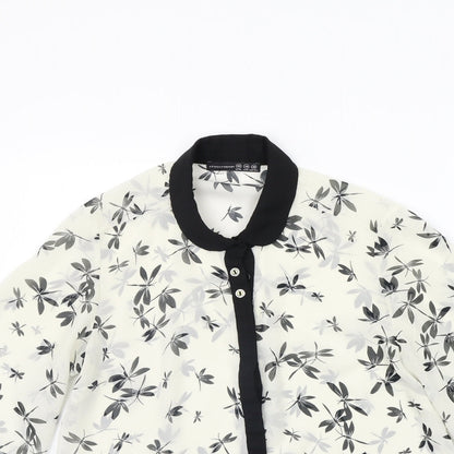 Close-up detail of Atmosphere women’s white floral basic button-up, size UK 10