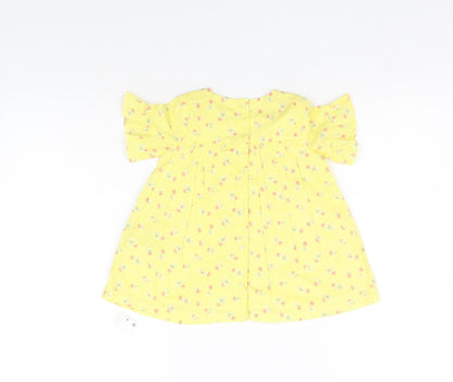Back view of Marks & Spencer boys’ yellow floral a-line, size 3-6, months