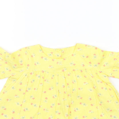 Close-up detail of Marks & Spencer boys’ yellow floral a-line, size 3-6, months