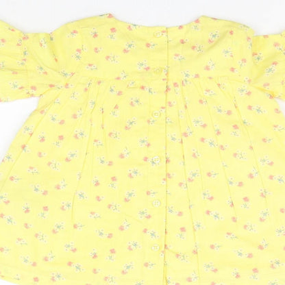 Brand and care label for Marks & Spencer boys’ yellow floral a-line, size 3-6, months