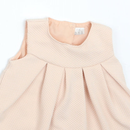 Close-up detail of F&F girls’ pink a-line, size 6-9, months
