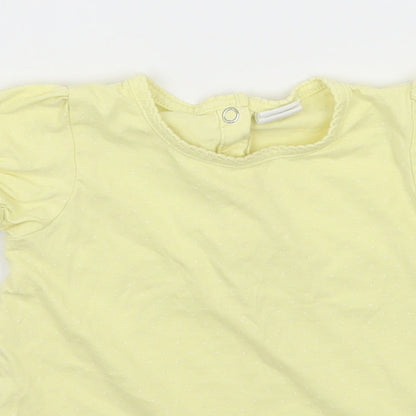 Close-up detail of H&M girls’ yellow polka dot jersey basic t-shirt, size 12-18, months