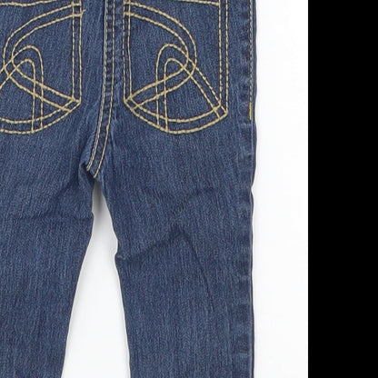 Brand and care label for Next girls’ blue denim capri jeans, size 6-9, months