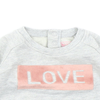 Close-up detail of Primark girls’ grey basic t-shirt, size 0-3, months