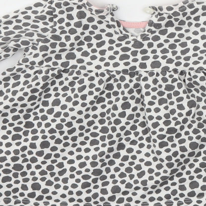 Brand and care label for F&F girls’ grey animal print fit & flare, size 3-6, months