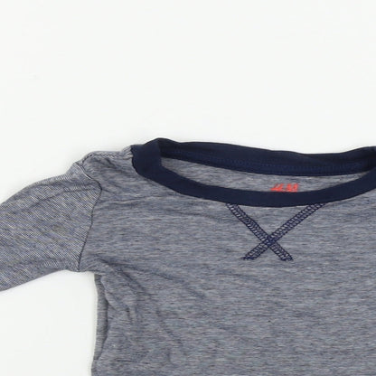 Close-up detail of H&M girls’ blue basic t-shirt, size 2, years