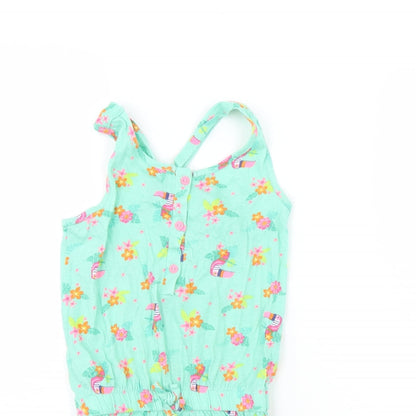 Close-up detail of Dunnes girls’ green floral playsuit one-piece, size 5, years
