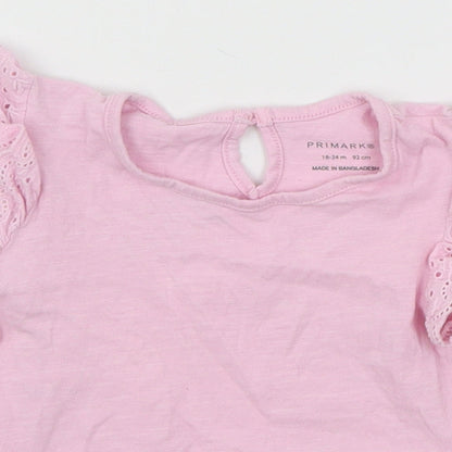 Close-up detail of Primark girls’ pink jersey basic t-shirt, size 18-24, months