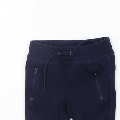 Close-up detail of Gap girls’ blue jogger trousers, size 6-9, months