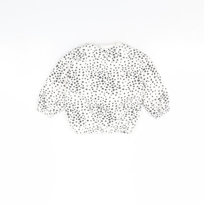 Back view of F&F girls’ white polka dot jumper, size 6-9, months