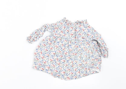Back view of Charanga girls’ white floral a-line, size 9-12, months