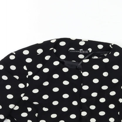 Close-up detail of Atmosphere women’s black polka dot rayon jacket, size UK 8