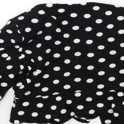 Brand and care label for Atmosphere women’s black polka dot rayon jacket, size UK 8