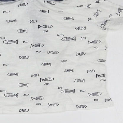 Brand and care label for F&F girls’ white geometric basic t-shirt, size 3-6, months