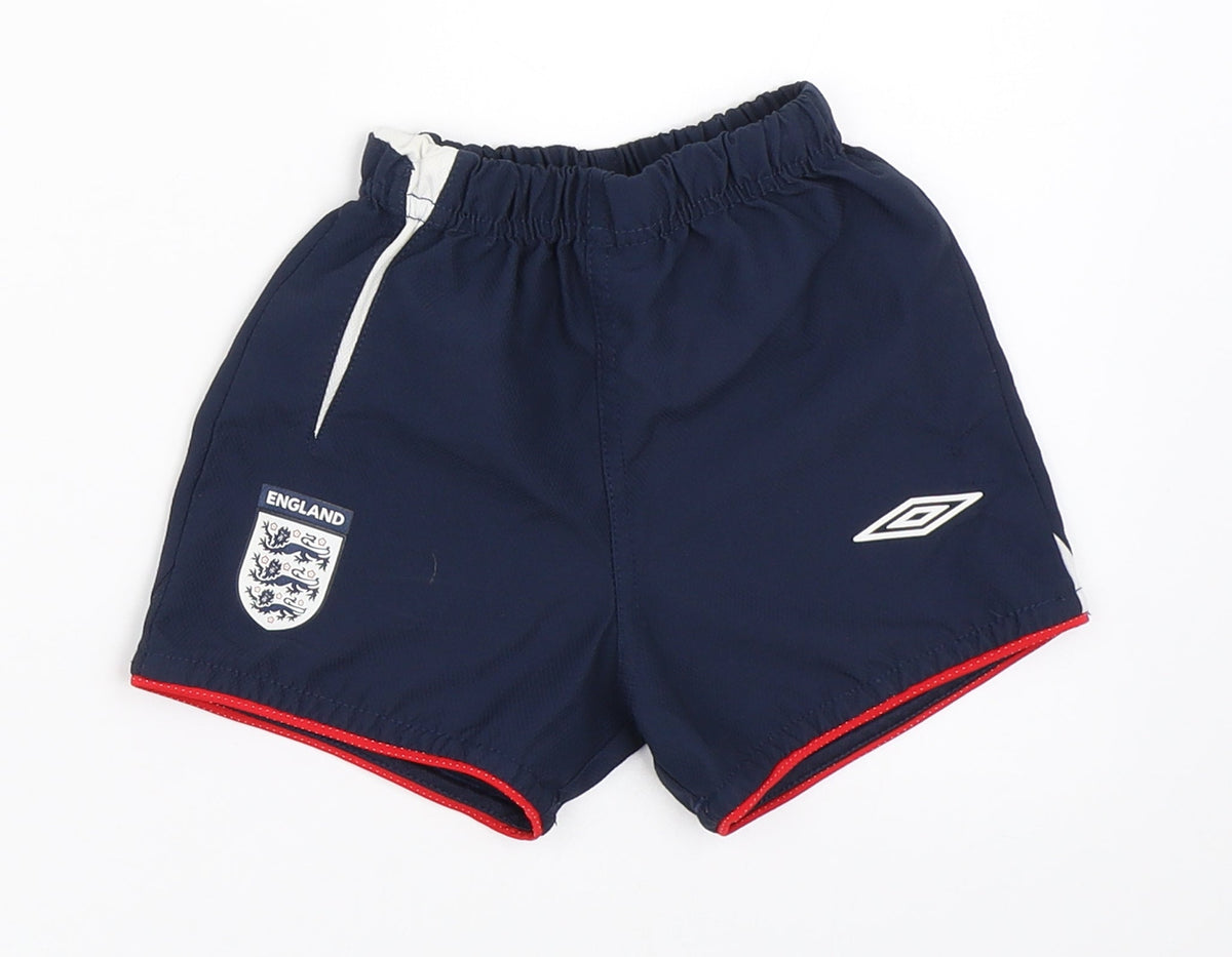 Additional front view of Umbro boys’ blue cropped trousers, size 6-9, months - england football shorts