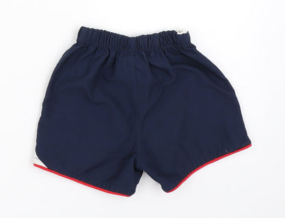 Back view of Umbro boys’ blue cropped trousers, size 6-9, months - england football shorts