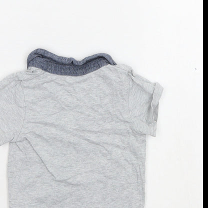 Brand and care label for Disney boys’ grey basic polo, size 12-18, months
