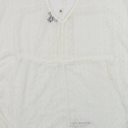 Brand and care label for Atmosphere women’s white basic blouse, size S