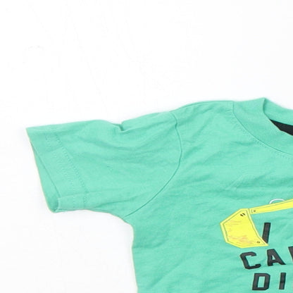 Close-up detail of Primark girls’ green basic t-shirt, size 3-6, months