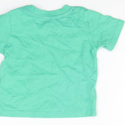 Brand and care label for Primark girls’ green basic t-shirt, size 3-6, months