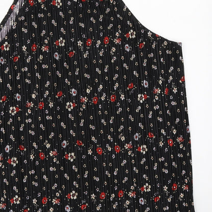 Brand and care label for New Look girls’ black floral basic blouse, size 14, years