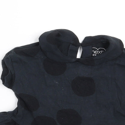 Close-up detail of Next girls’ black polka dot basic t-shirt, size 9-12, months
