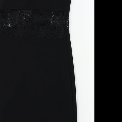 Brand and care label for Miss Selfridge women’s black a-line, size UK 4