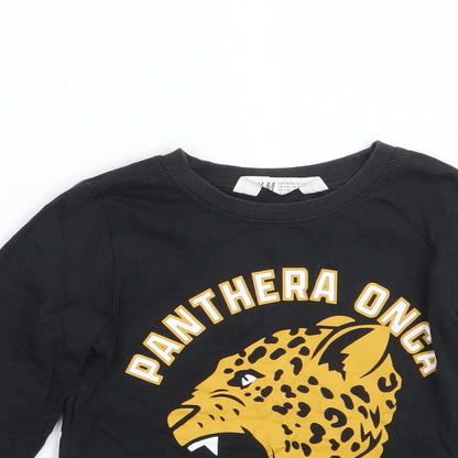 Close-up detail of H&M girls’ black basic t-shirt, size 4, years