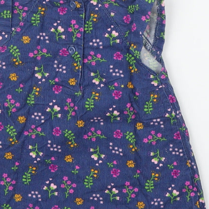 Brand and care label for Baby Club girls’ blue floral corduroy a-line, size 0-3, months