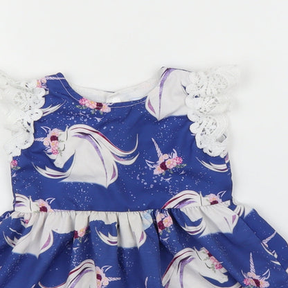 Close-up detail of CANIS girls’ blue a-line, size 12, months - unicorn