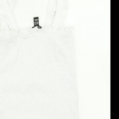 Brand and care label for 915 Generation girls’ white cropped tank, size 12-13, years