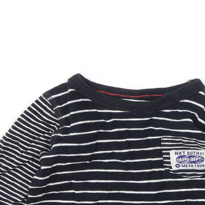 Close-up detail of Next girls’ black jumper, size 6-9, months