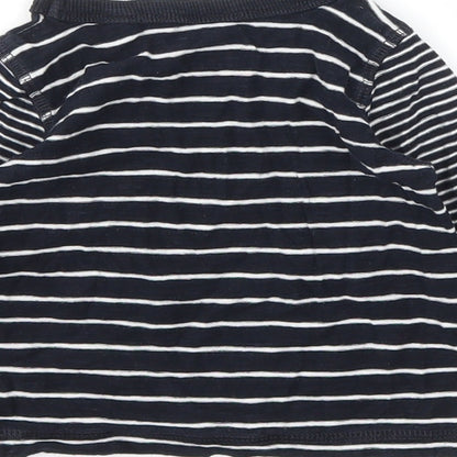 Brand and care label for Next girls’ black jumper, size 6-9, months