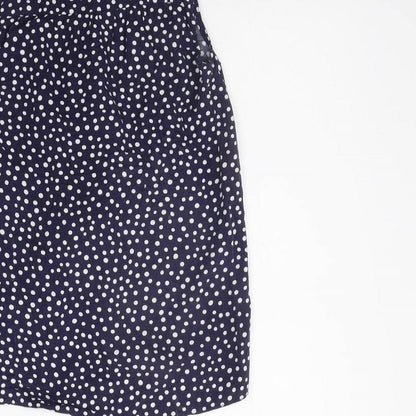 Brand and care label for Nutmeg girls’ blue polka dot basic button-up, size 10-11, years