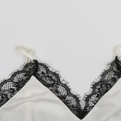 Close-up detail of Missguided women’s white cropped tank, size UK 4