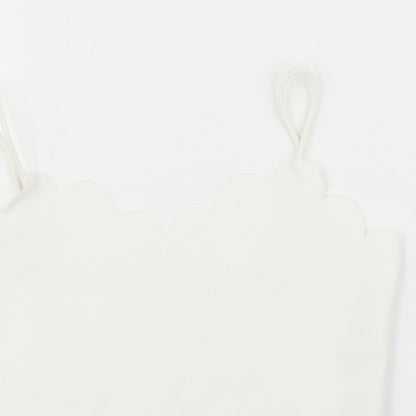 Close-up detail of SHEIN girls’ white camisole blouse, size 7, years