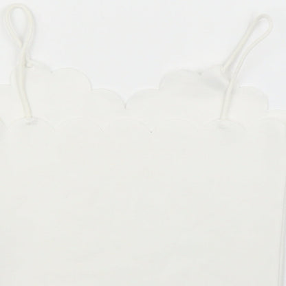 Brand and care label for SHEIN girls’ white camisole blouse, size 7, years