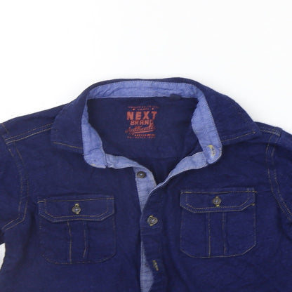 Close-up detail of Next girls’ blue basic polo, size 5-6, years