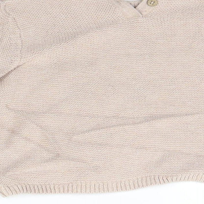 Brand and care label for Next girls’ beige jumper, size 12-18, months