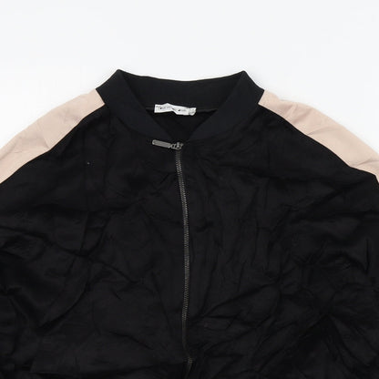 Close-up detail of Light Before Dark girls’ black colourblock jacket, size L