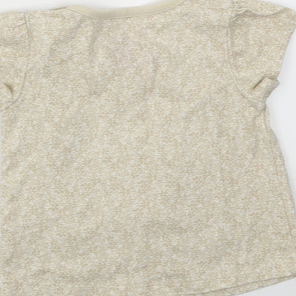 Brand and care label for Tu girls’ beige basic t-shirt, size 0-3, months