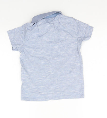 Back view of Primark girls’ blue basic polo, size 6-7, years