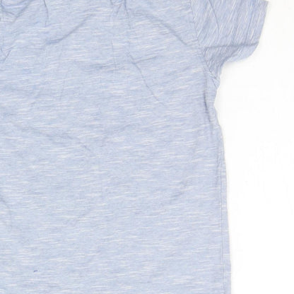 Brand and care label for Primark girls’ blue basic polo, size 6-7, years