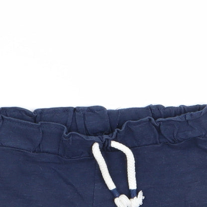 Close-up detail of F&F girls’ blue capri trousers, size 18-24, months - shorts