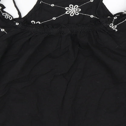 Brand and care label for New Look girls’ black basic blouse, size 11, years