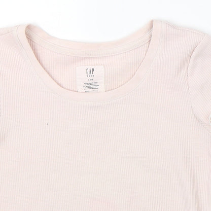 Close-up detail of Gap girls’ pink cropped t-shirt, size 10-11, years