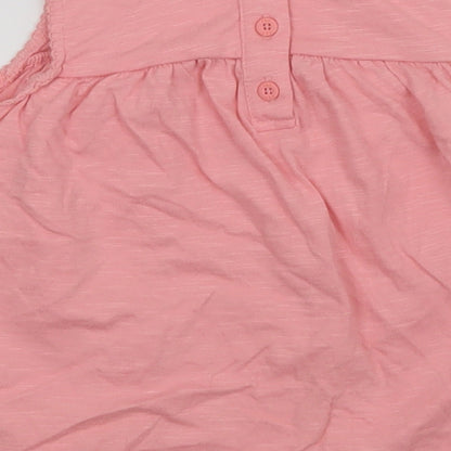 Brand and care label for F&F girls’ pink a-line, size 12-18, months