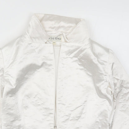 Close-up detail of In the Style women’s white jacket, size UK 6