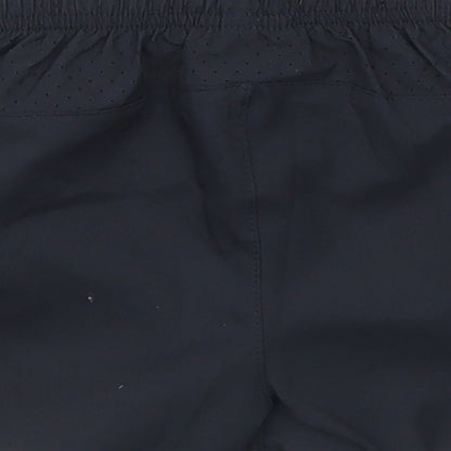 Brand and care label for Umbro boys’ black cropped trousers, size 3-6, months